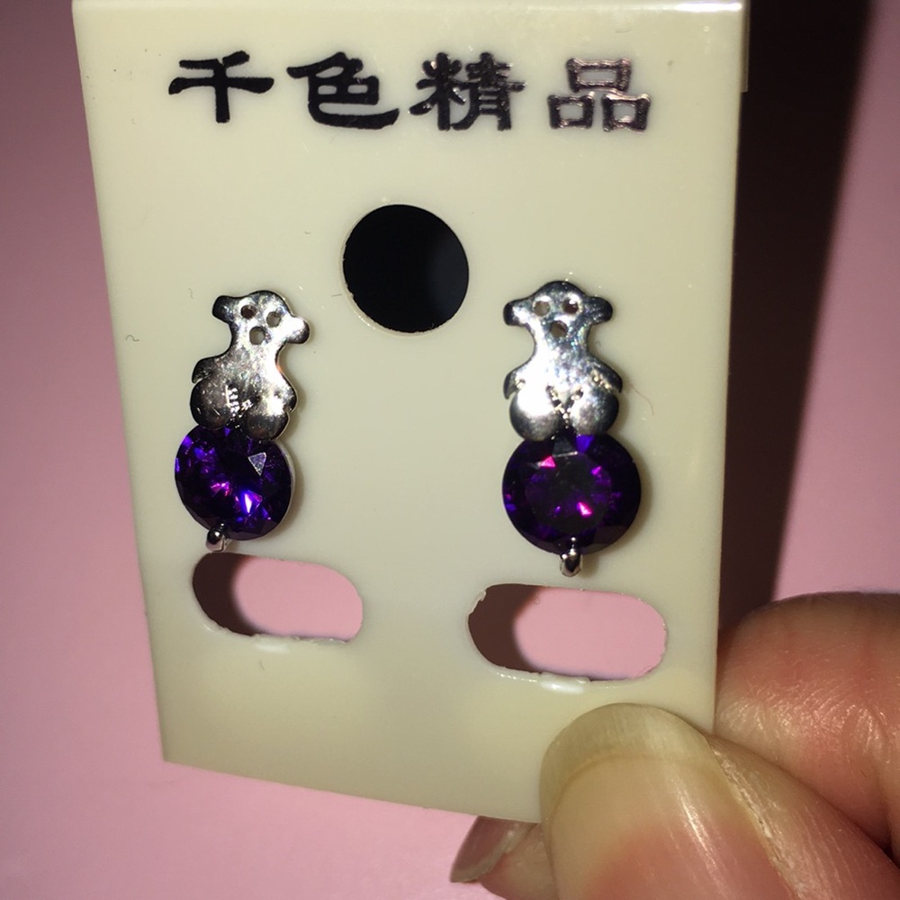 silver earrings with purple crystal